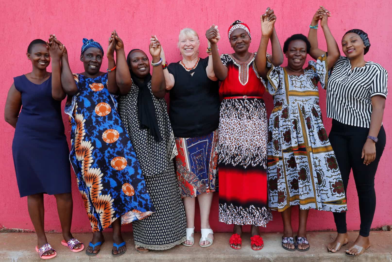Naomi meets with women from the Kampala Women’s Craft Group, Uganda, on one of her many field visits as National Director.