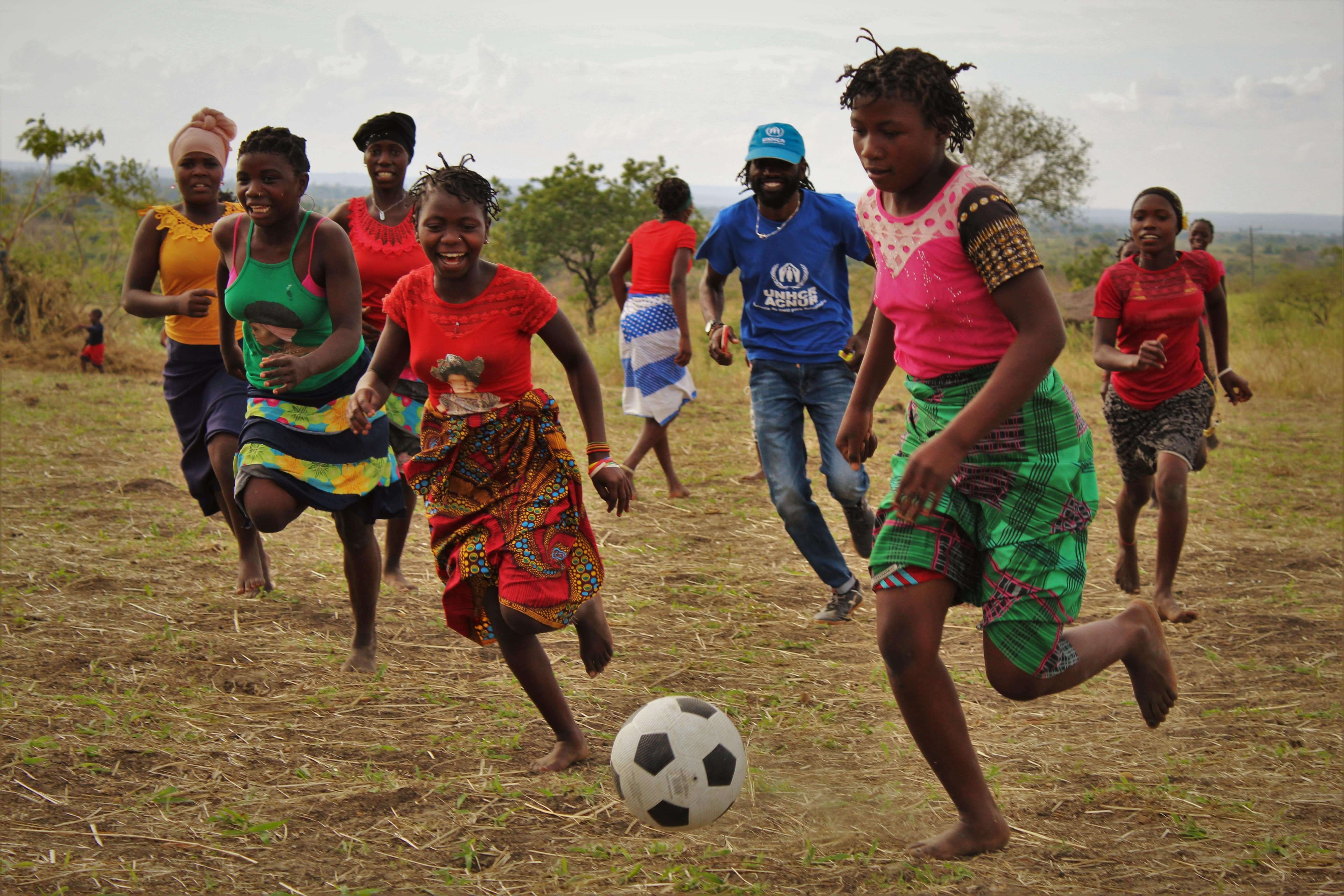 Displaced and host community girls play football in Cabo Delgado. As part of the World Refugee Day celebrations, UNHCR organized a football match for displaced and host community girls in Ngalane IDP site in Metuge, Cabo Delgado, northern Mozambique.