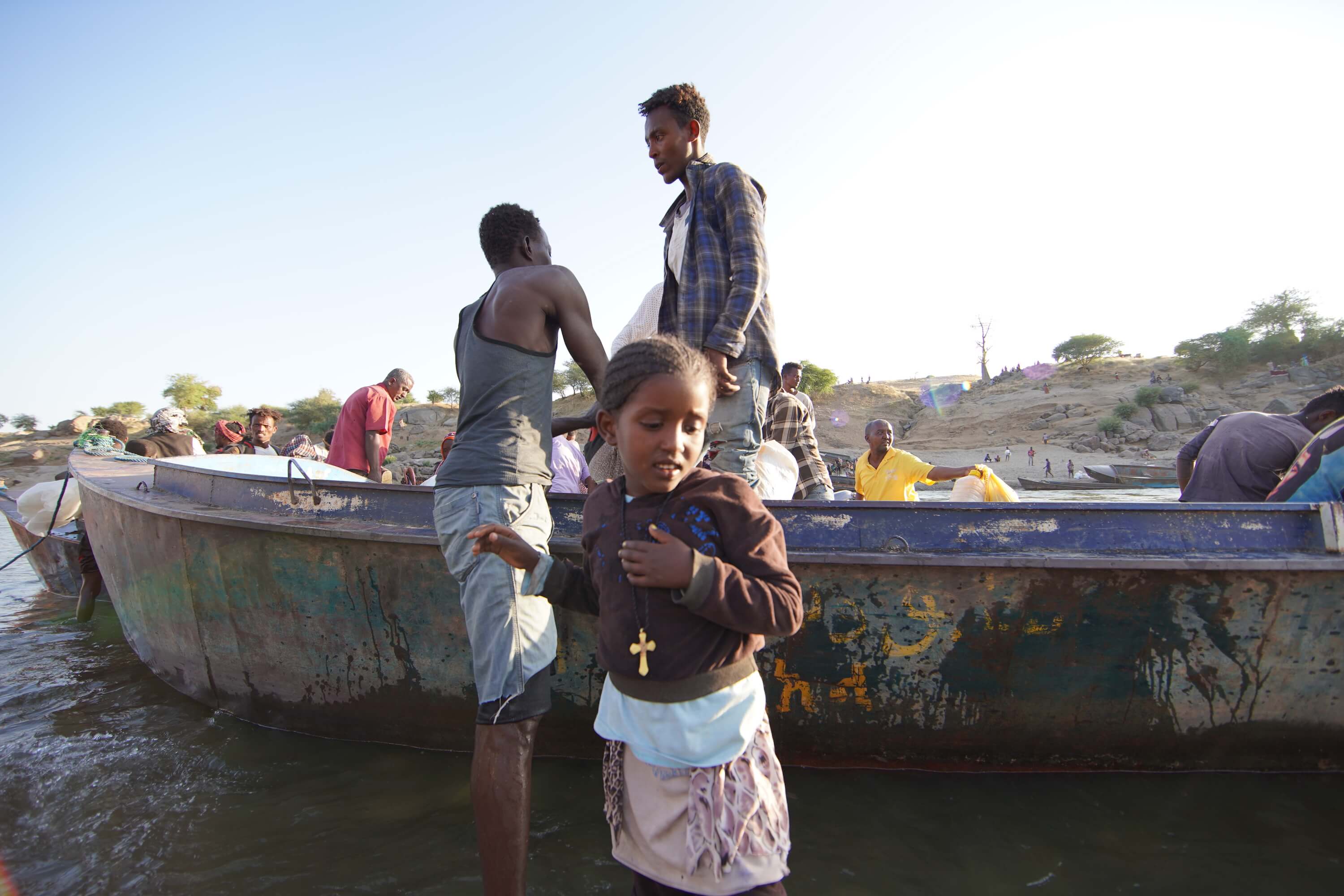 Ethiopian refugees fleeing clashes in the country's northern Tigray region, cross the border into Hamdayet, Sudan.