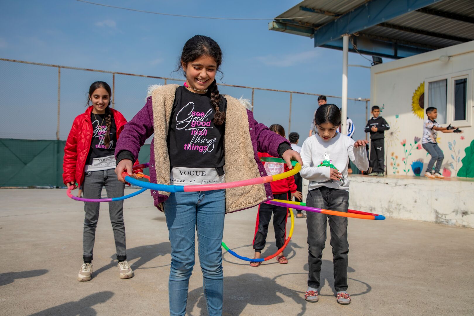 A group of Syrian refugee youth take part in sposts activities at UNHCR community centre in Darashakran camp in Erbil