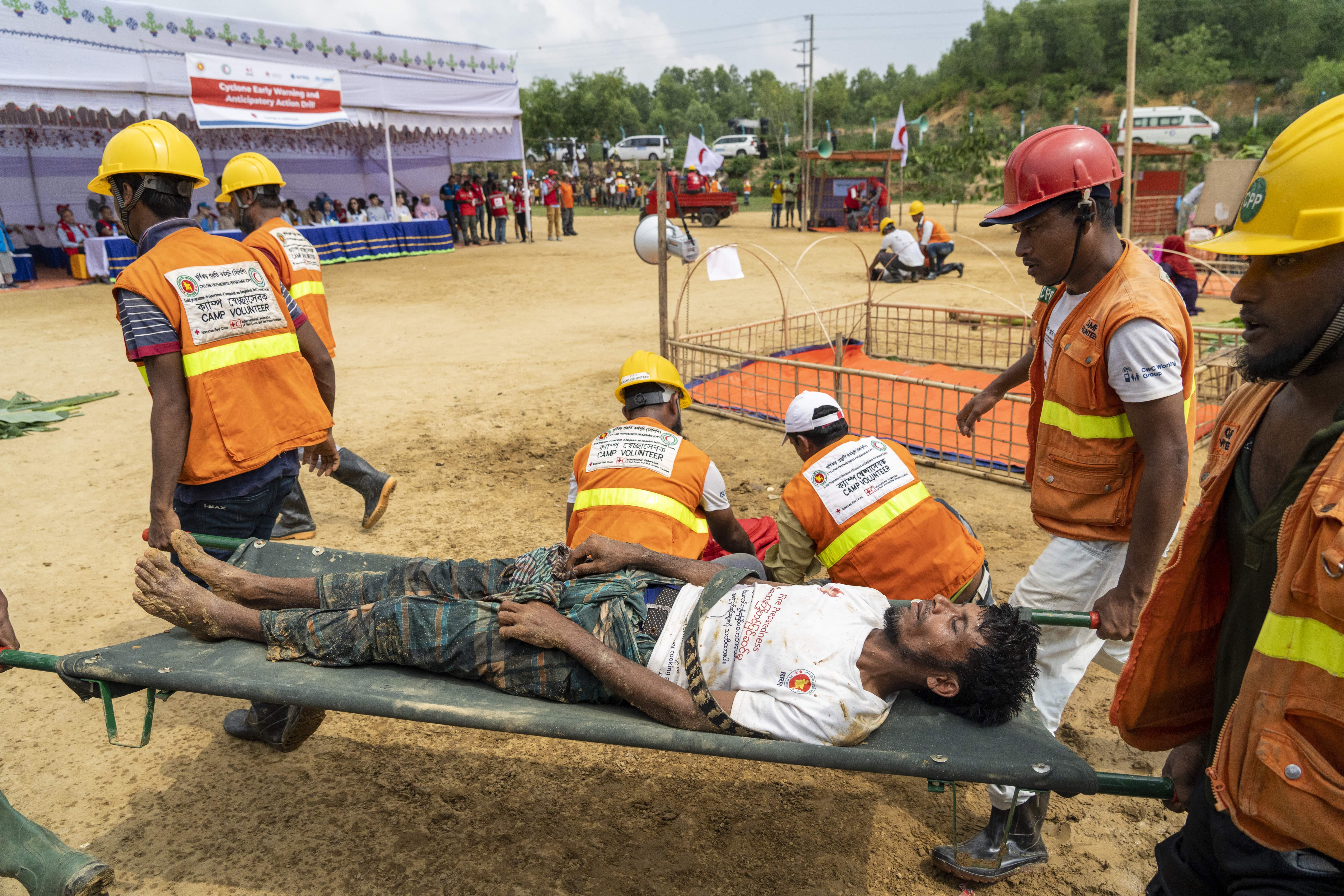 Bangladesh. Rohingya refugees practice a cyclone action drill