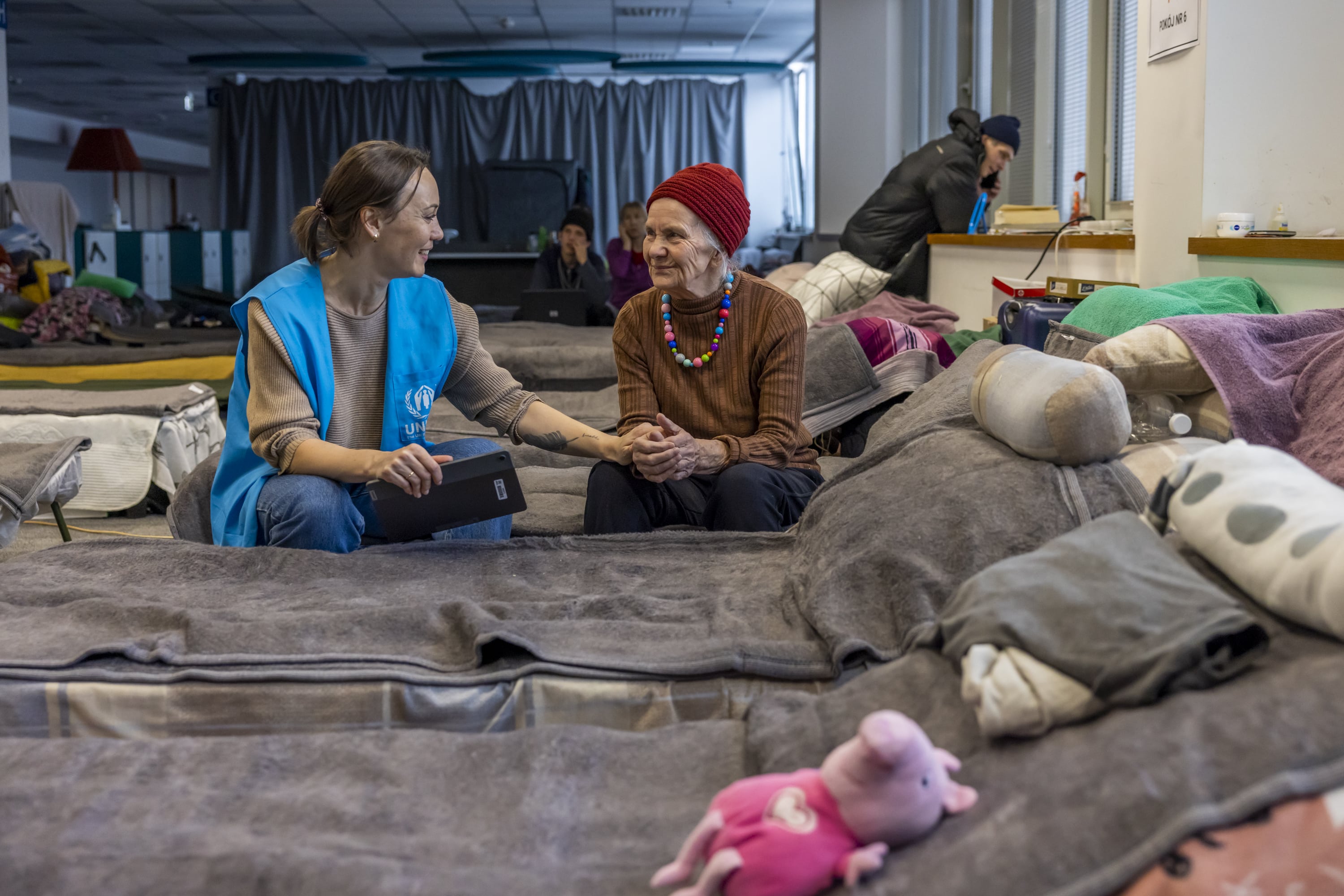 UNHCR protection monitor Svetlana Lokian is conducting an interview with Valentina