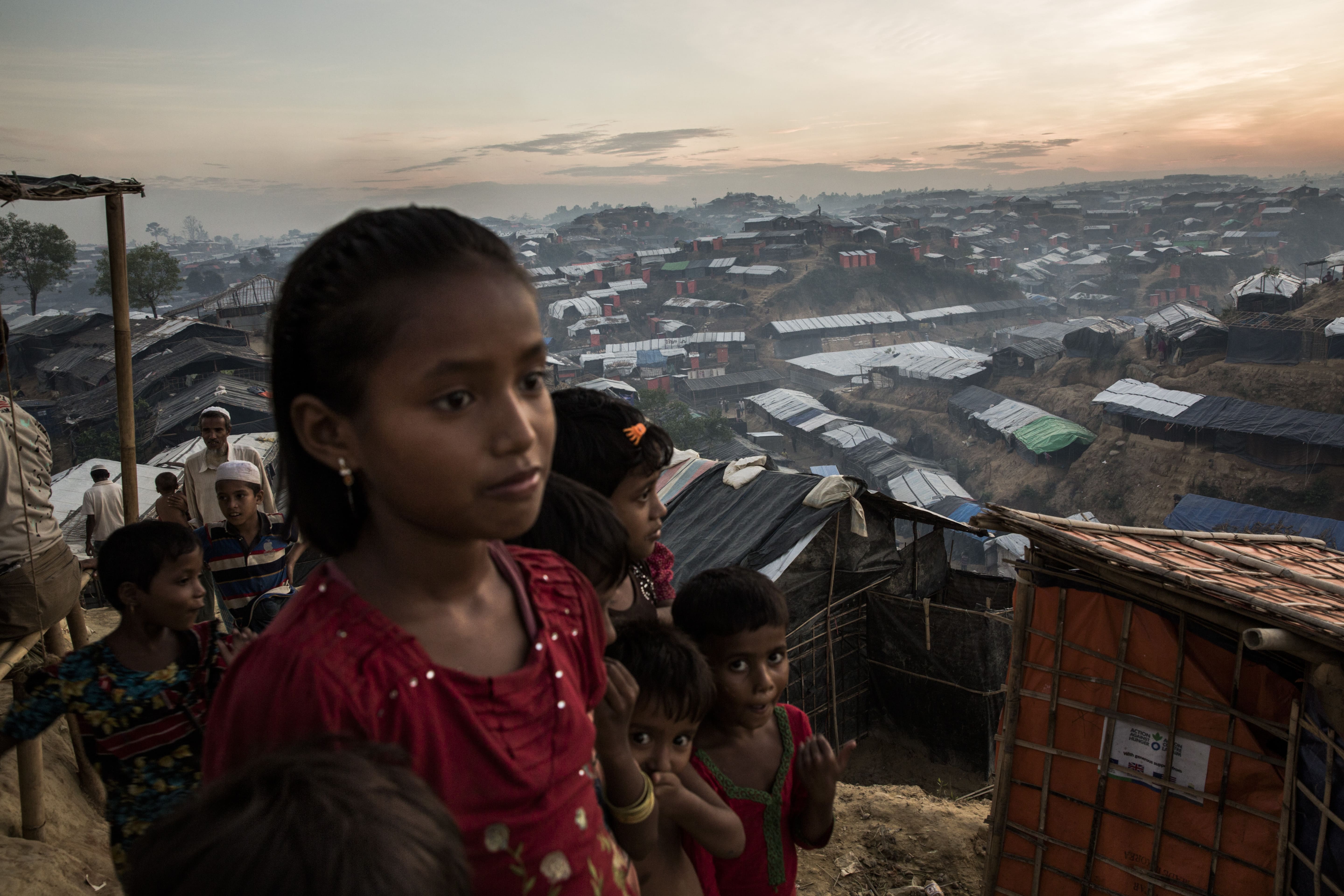 Young Rohingya refugees look out over Palong Khali refugee camp, a sprawling site located on a hilly area near the Myanmar border in south-east Bangladesh. 