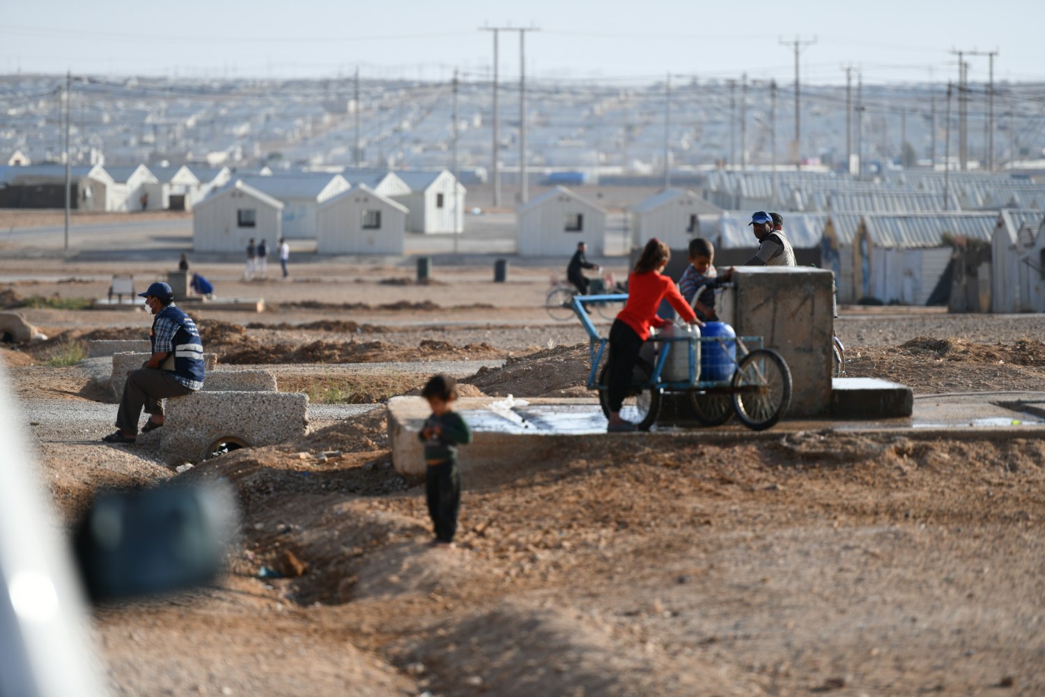 Refugees collect water in Azraq camp in Jordan.