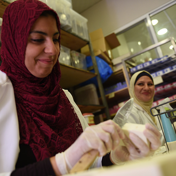 Women carve soap in Za'atari refugee camp to protect people from coronavirus
