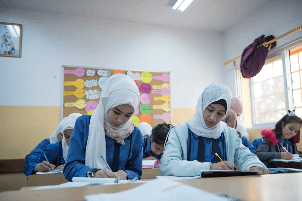 Aryam and her classmates studying at their school in Jordan.