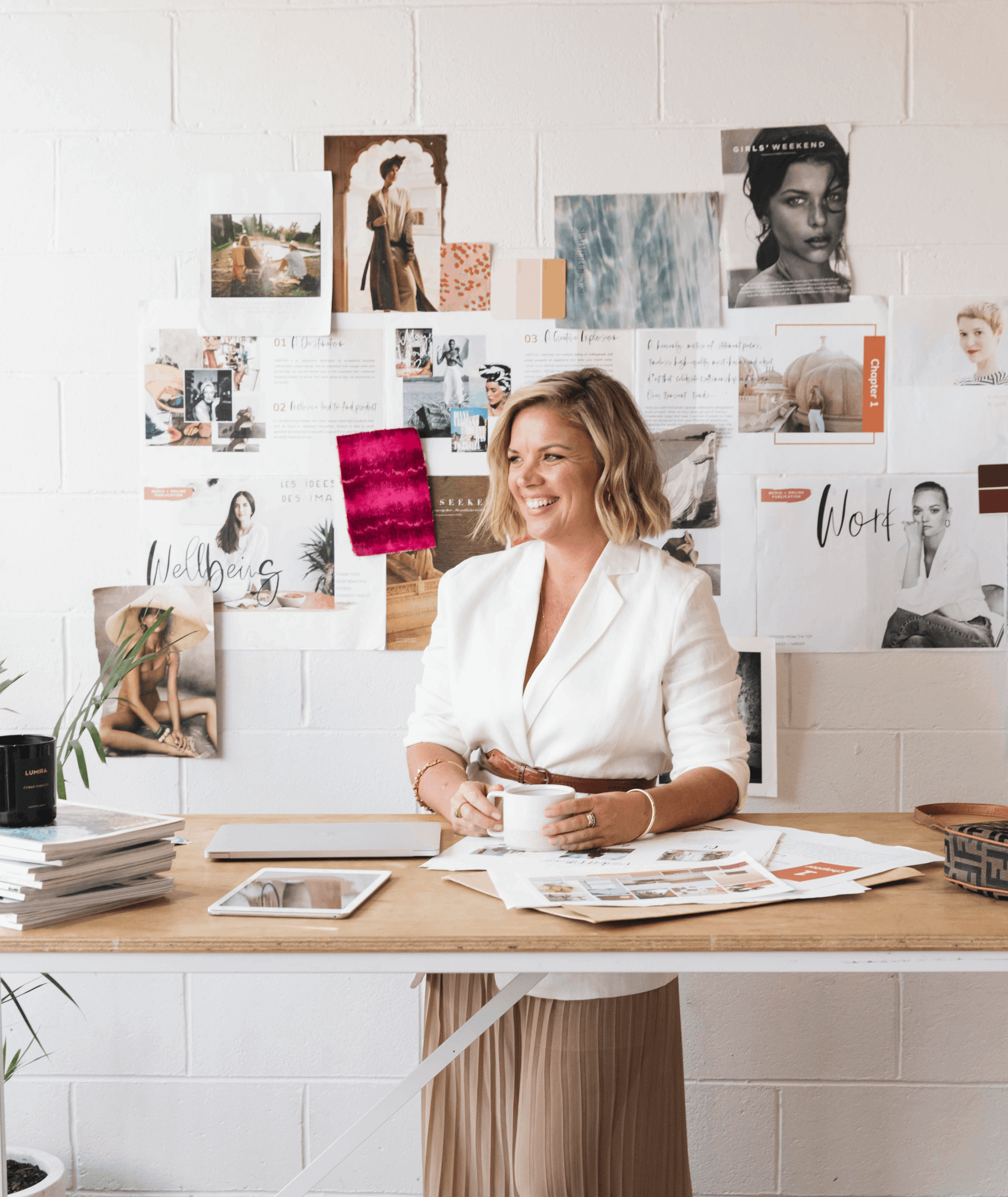 Jess Mester, a Leading Women Fund member, stands at her desk.