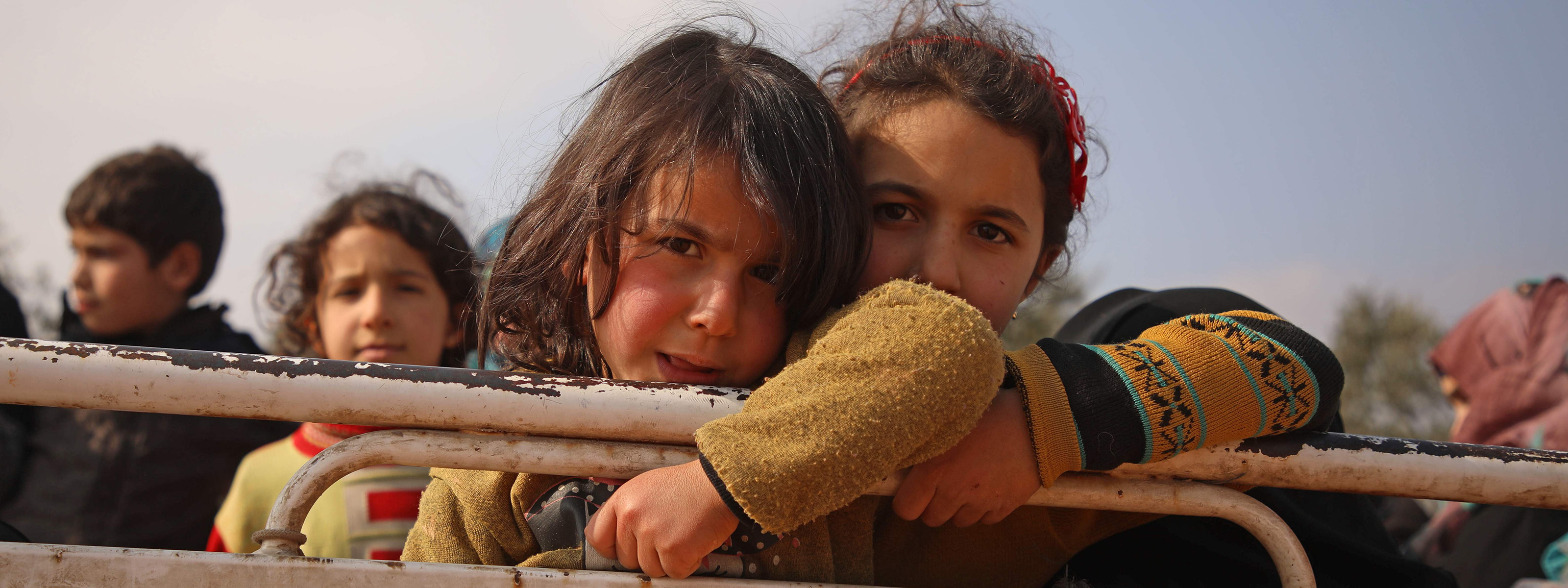Two Syrian girls arrive at a newly established camp in Maaret Misrin in Idlib province